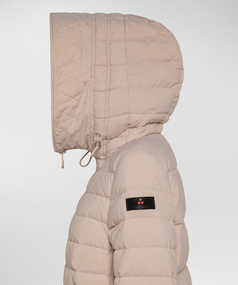 Long down jacket with fur in color tone